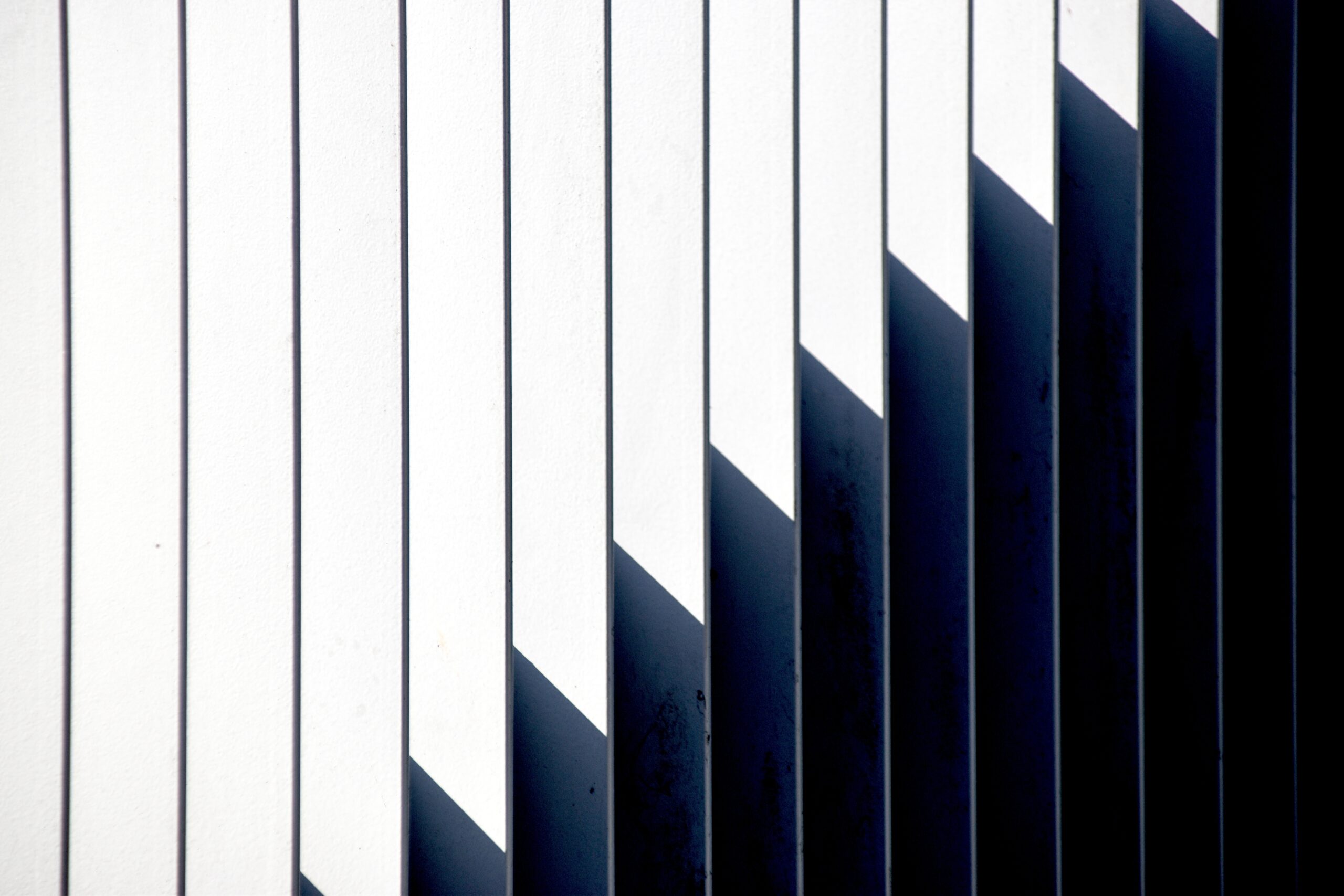 white-wall-with-shadow-lines-abstract-pattern